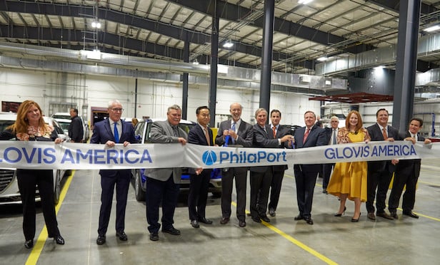 At the ribbon cutting ceremony were from left: Lisa Magee, director of engineering, PhilaPort; Jeff Theobald, executive director and CEO, PhilaPort; Jimmy Durr, general manager, Glovis America; JinWoo Jeong, president and CEO, Glovis; Governor of Pennsylvania, Tom Wolf; Jerry Sweeney, PhilaPort Board Chairman; Pennsylvania State Senator Larry Farnese; Scott Cornell, COO, Glovis America; Jennie Granger, Deputy Secretary, PennDot; Glenn Clift, advisor, Glovis America; Charles Gallub, president, DVR.