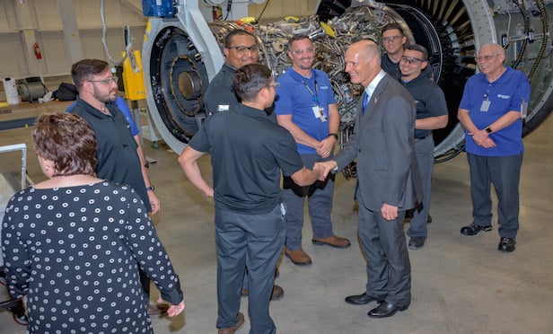 Florida Gov. Rick Scott greets Pratt & Whitney workers at the event announcing the firm's expansion in West Palm Beach. Photo Credit: Pratt & Whitney