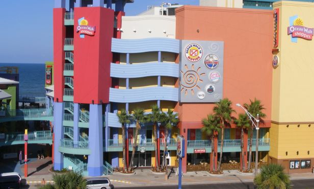 The retail property sits directly in front of the 5,000-person Daytona Beach Bandshell amphitheater  between both the 744-room Hilton Daytona Beach and the 710-room Wyndham Ocean Walk. 