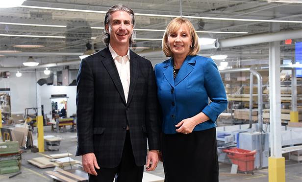 Michael Ostroff, CEO of Patella Woodworking, left, and NJ Lt. Gov. Kim Guadagno at Patella's new Passaic, NJ, plant.