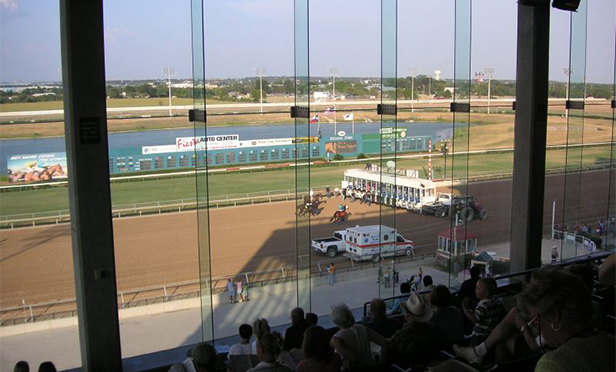 Horse racing gets underway at Retama Park, one of Pinnacle Entertainment's properties, in Austin, TX. (Photo by Scott Davis via Flickr.com under Creative Commons 2.0 license)