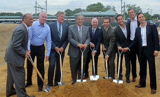 Local officials and development partners break ground on the Aberdeen Transit Village property. From left to right: Thomas A. Arnone, Monmouth County Freeholder Director; Jim Smith, Principal of Highview Homes; Frank Pallone, U.S. Representative (NJ); Fred Tagliarini, Mayor of Aberdeen Township; Jeffrey A. Nadell, Senior Director of Real Estate & Economic Development for NJ TRANSIT; Gerard P. Scharfenberger, Mayor of Middletown Township; Jonathan Schwartz, Principal of BNE Real Estate Group; David Pantirer, Executive Vice President of BNE Real Estate Group; Marc Pantirer, Executive Vice President of BNE Real Estate Group
