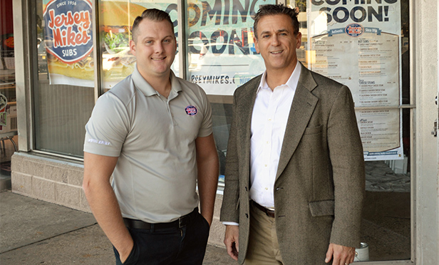 Chris Rigassio, left, franchise operator, and Gary Krauss of Pierson Commercial Real Estate, in front of new Jersey Mike's Subs location, •65-99 Old State Road, Spotswood, NJ