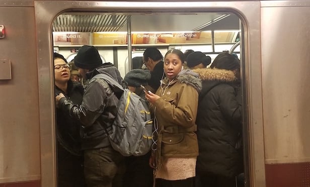 MTA subway riders/ Photo by Betsy Kim